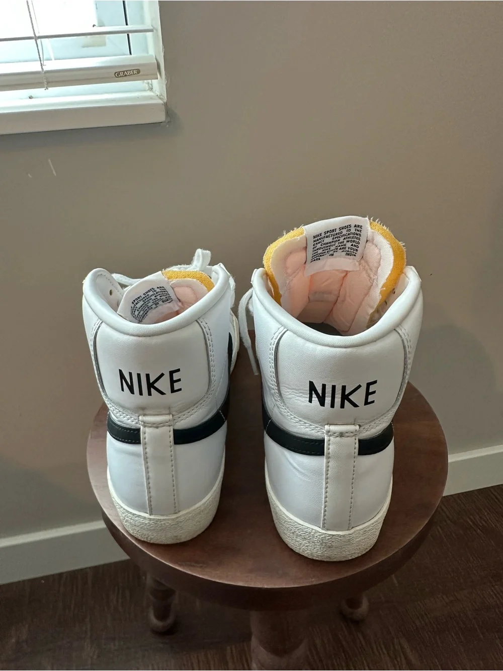 Nike White High-Top Sneakers with Black Swoosh and Pink Tongue